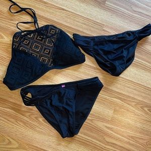 black bathing suit top with 2 bottoms